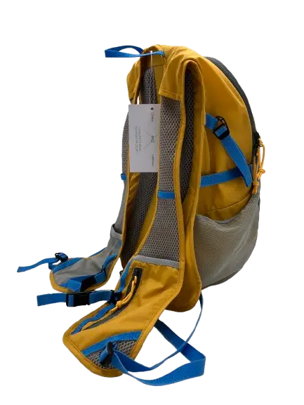 Side view of the mustard-yellow daypack with grey lower panel, blue padded straps and waist belt clip