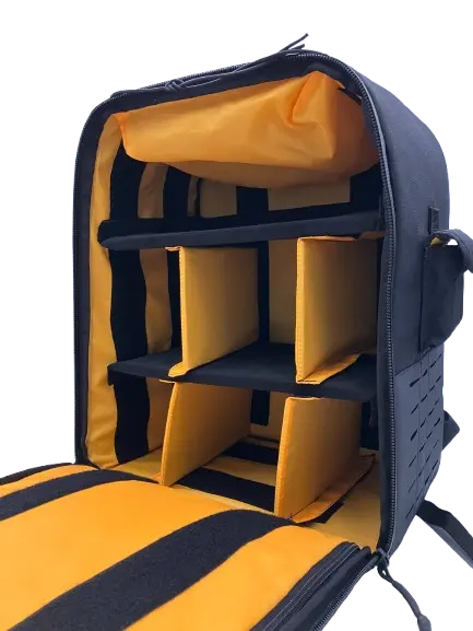 Open main compartment showing yellow padded dividers and organizer sections on black interior fabric
