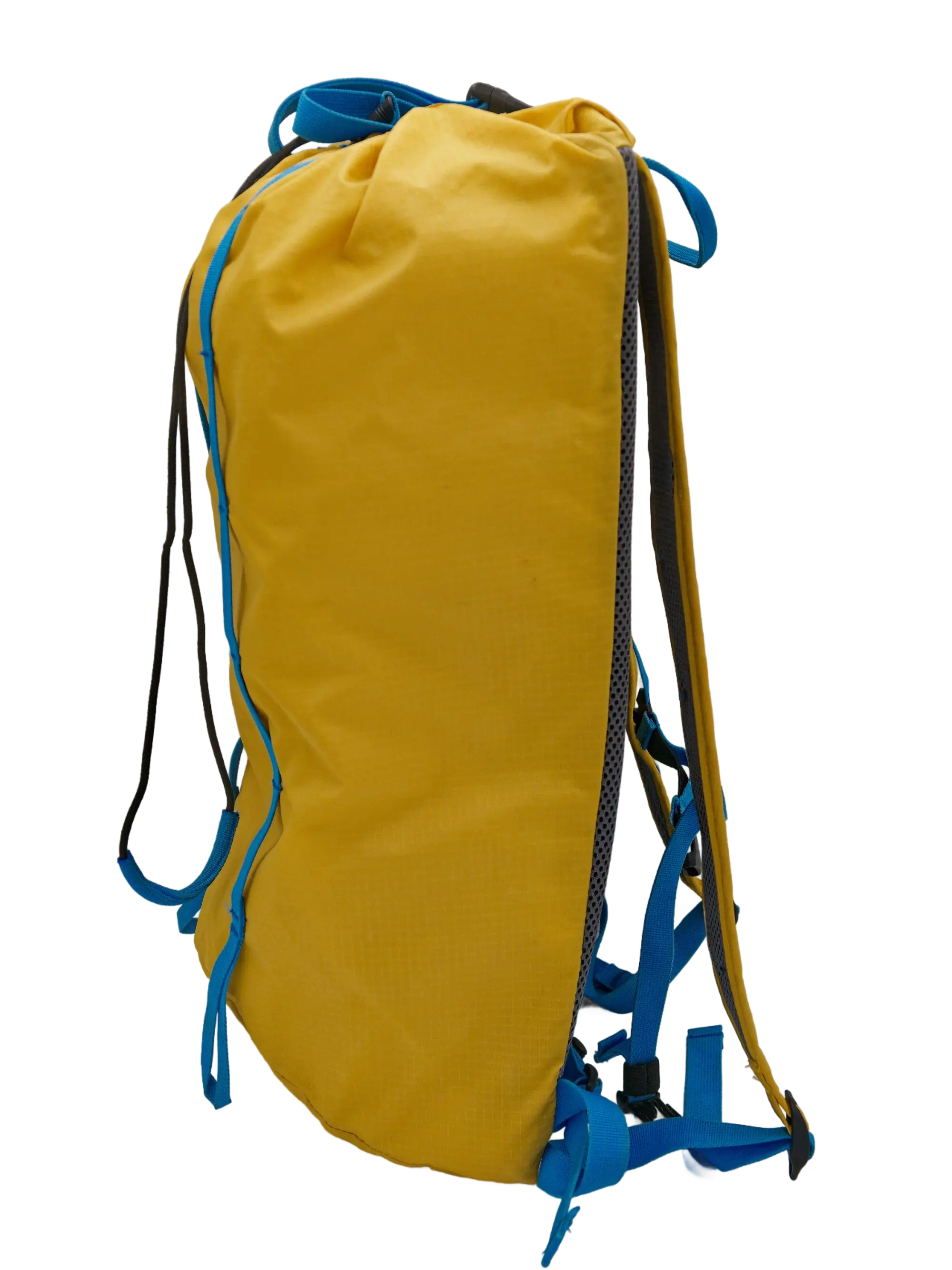 Side view of the yellow double ripstop nylon trail backpack with blue webbing accents and zippered side panel