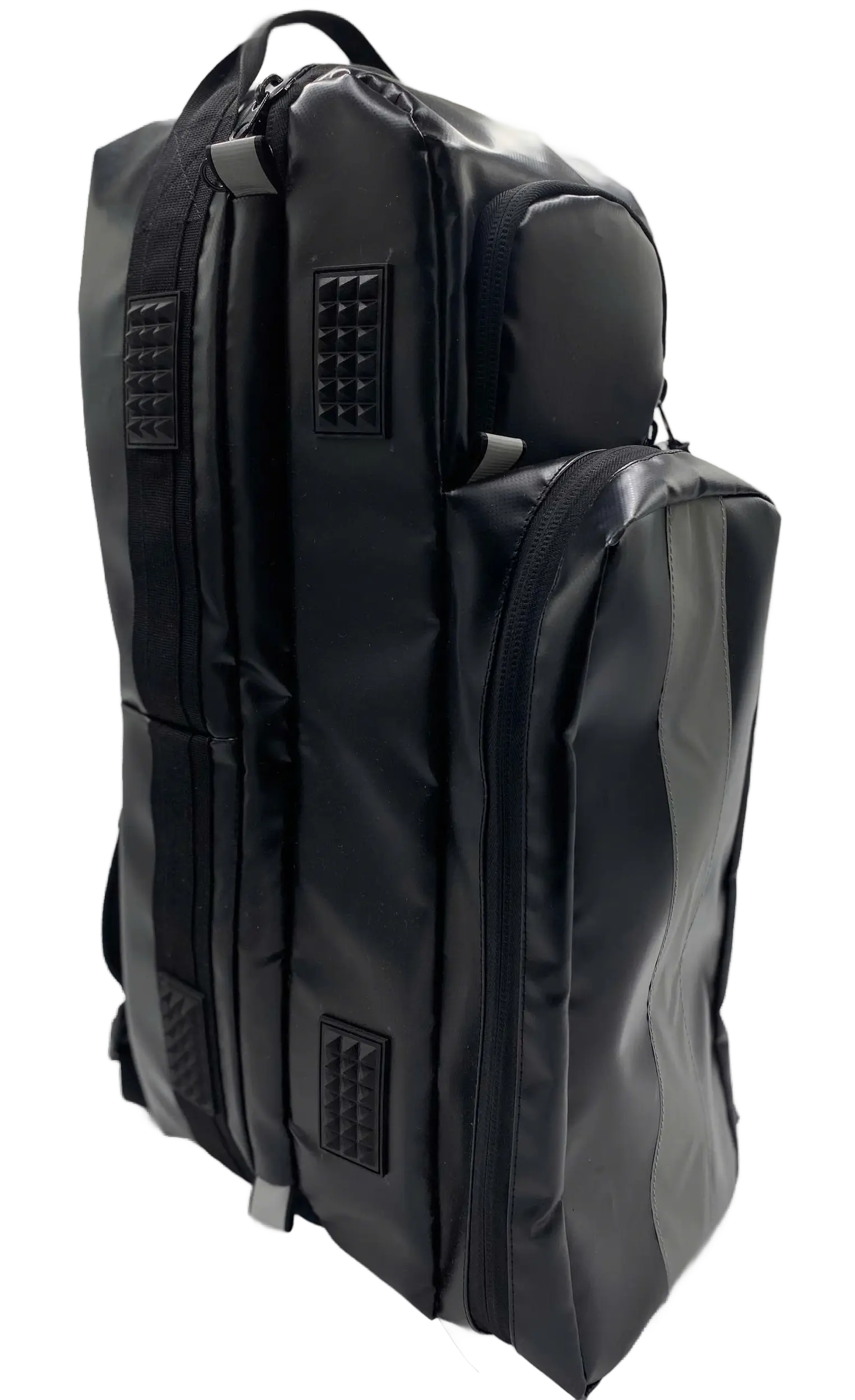 Side view of the black wipe-clean oxygen cylinder backpack showing two chrome valve outlets and a top grab handle