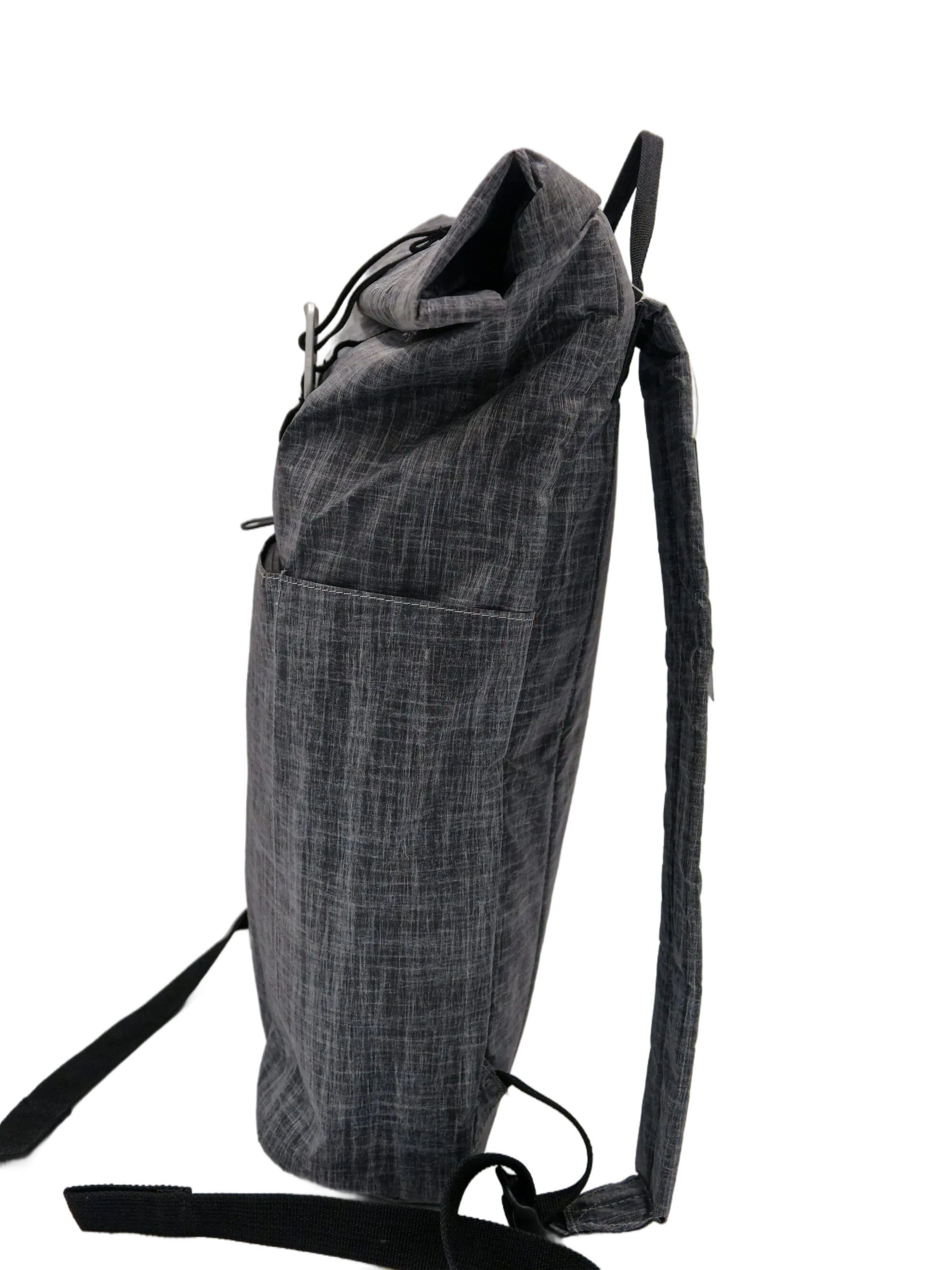 Side profile of the grey Dyneema rolltop backpack in its unrolled extended position with a front zip pocket visible