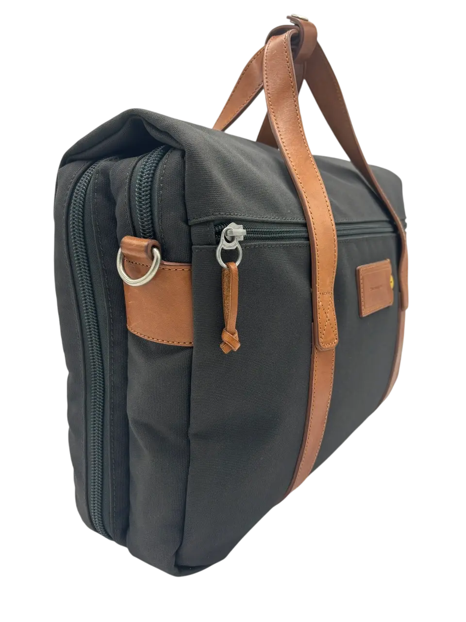Side profile of the dark grey recycled canvas laptop messenger with tan leather handles, trim and zipper pull accents