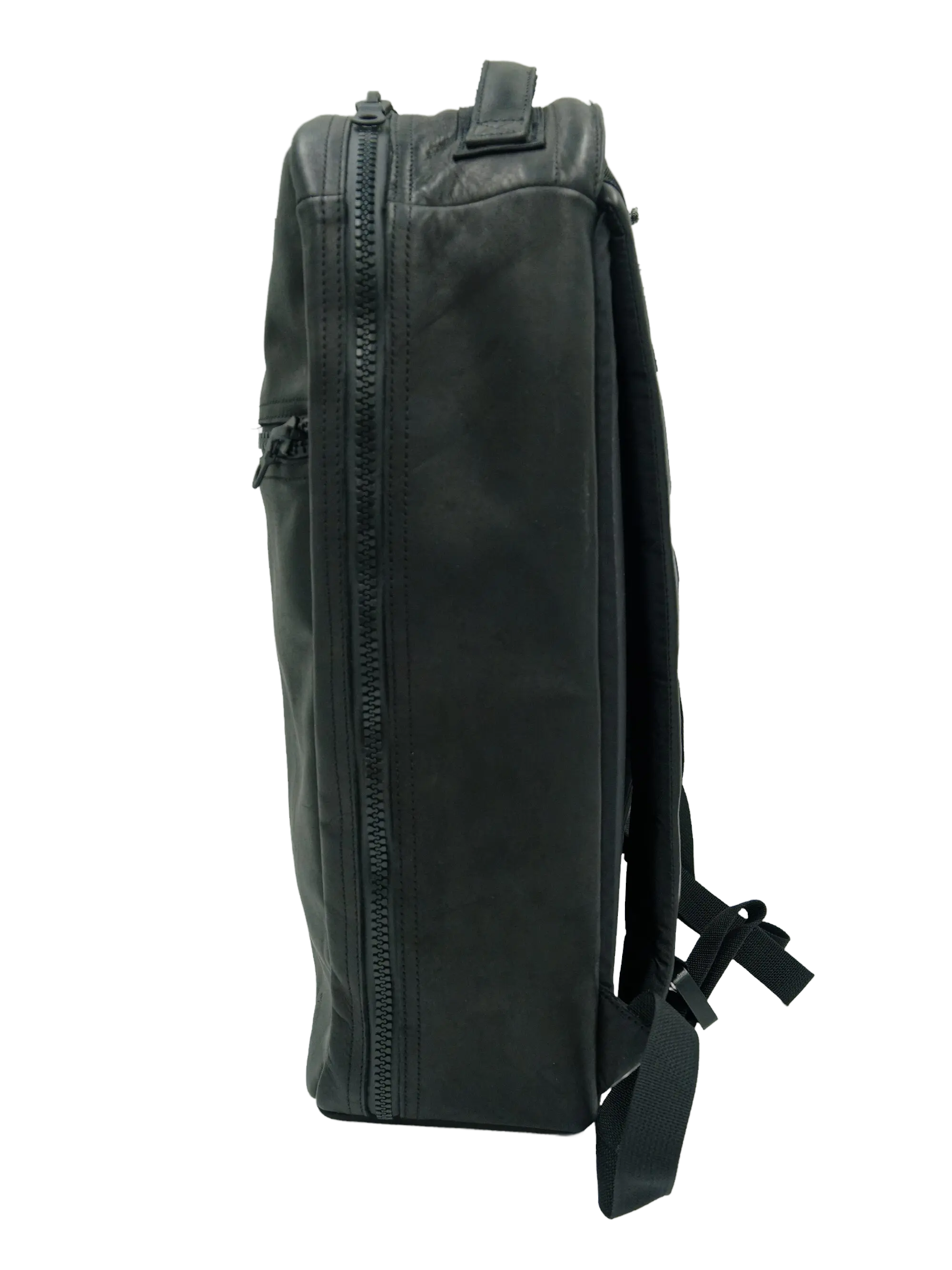Side profile of the dark grey goat leather backpack showing the full-length zipper and structured leather exterior
