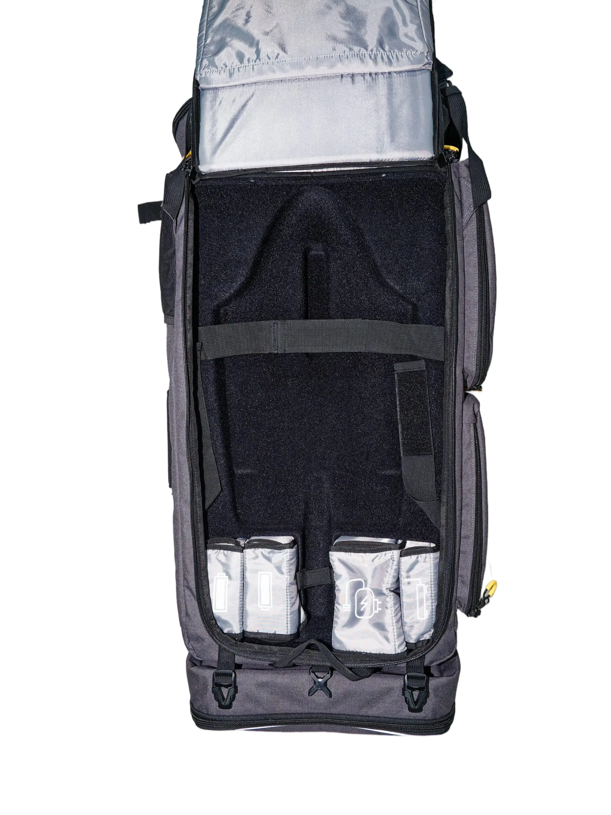 Overhead view of the open grey drone carrier showing black foam interior, drone body cutout, and silver battery pouches