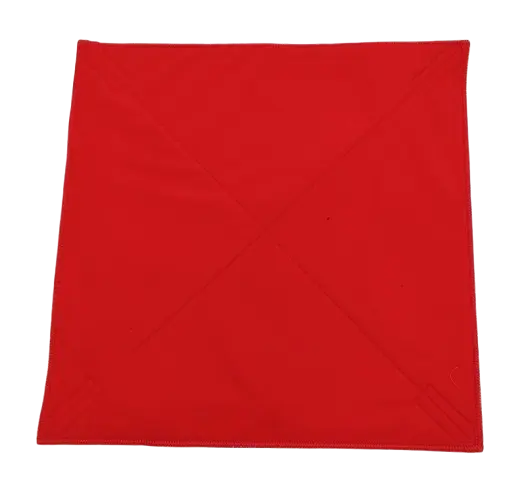 Flat lay of the red soft inner face of the padded wrap showing diagonal stitched fold lines and bound perimeter edge
