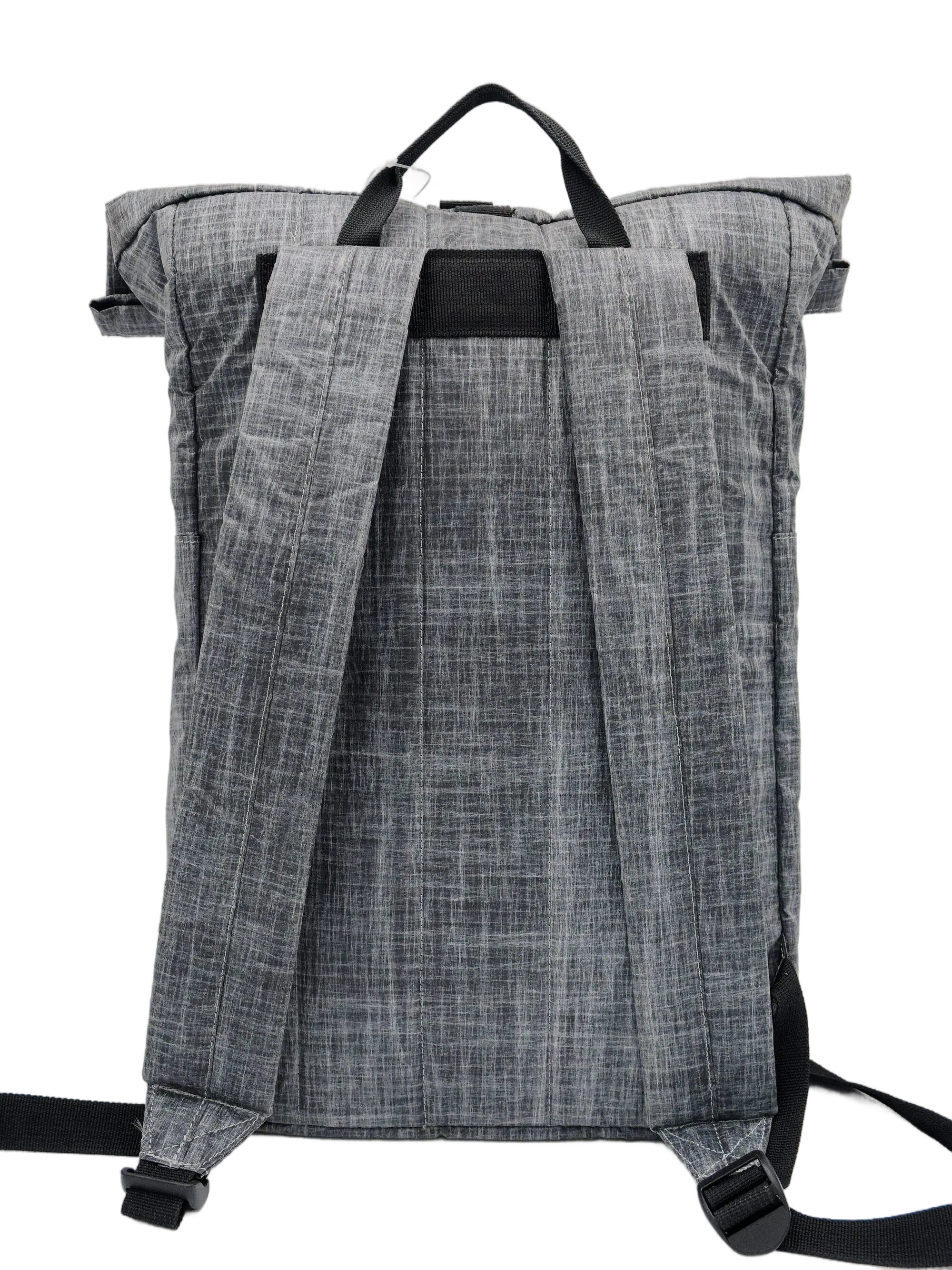 Rear view of the grey Dyneema rolltop backpack showing flat black padded shoulder straps and a top grab handle