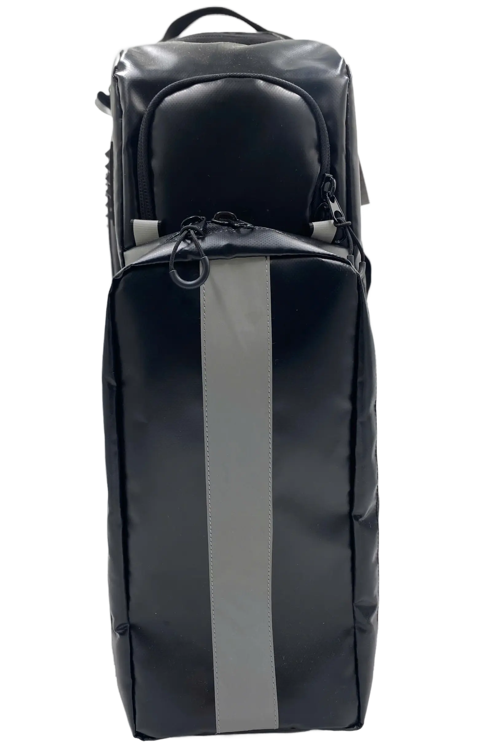 Angled side view of the black coated backpack showing raised rubber grip panels and long zip cylinder compartments