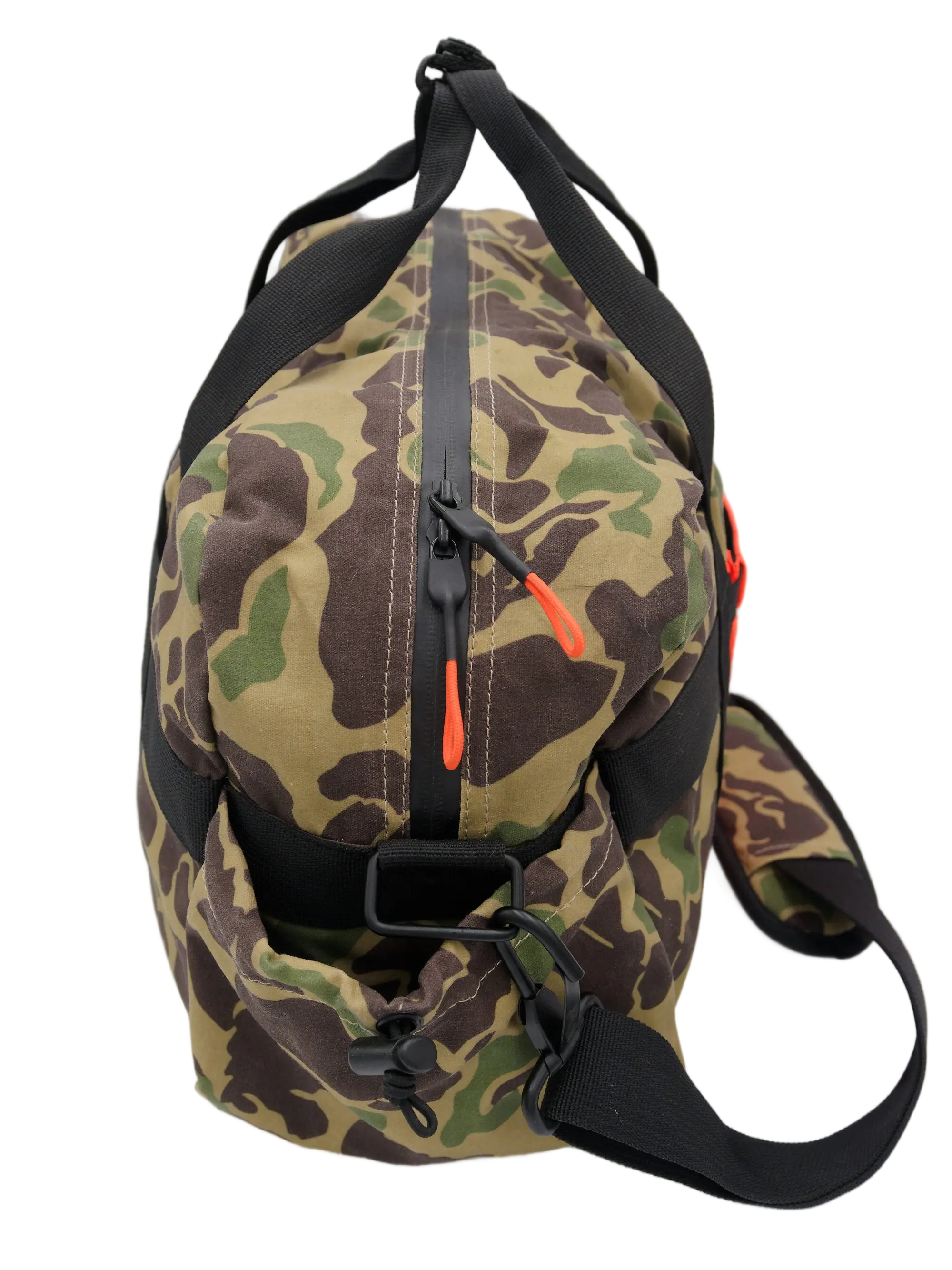 Top-down view of the camo duffle showing the center zip closure with orange zipper pull and shoulder strap buckle
