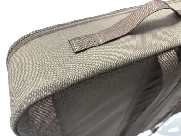 Close-up of the tan nylon drone bag top corner showing reinforced carry handle and YKK zipper