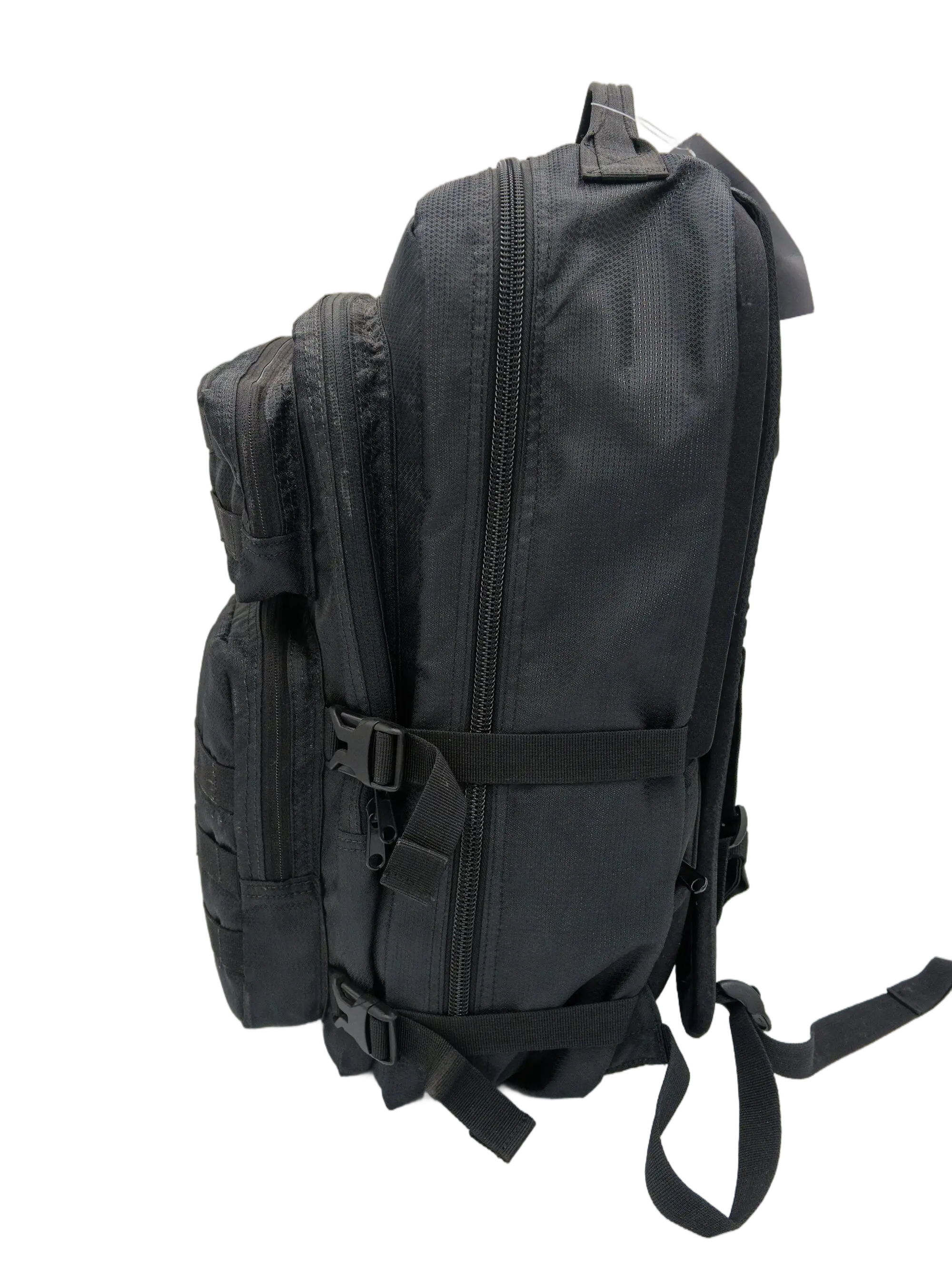 Side profile of the black tactical backpack showing the main zipper, compression straps with buckles, and padded back panel