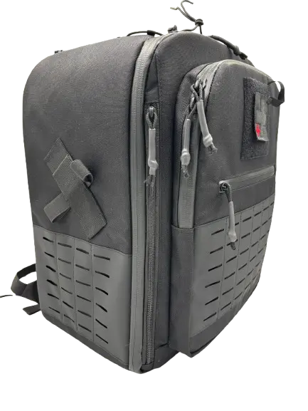Charcoal tactical drone backpack with MOLLE webbing panel, compression straps, and padded shoulder harness