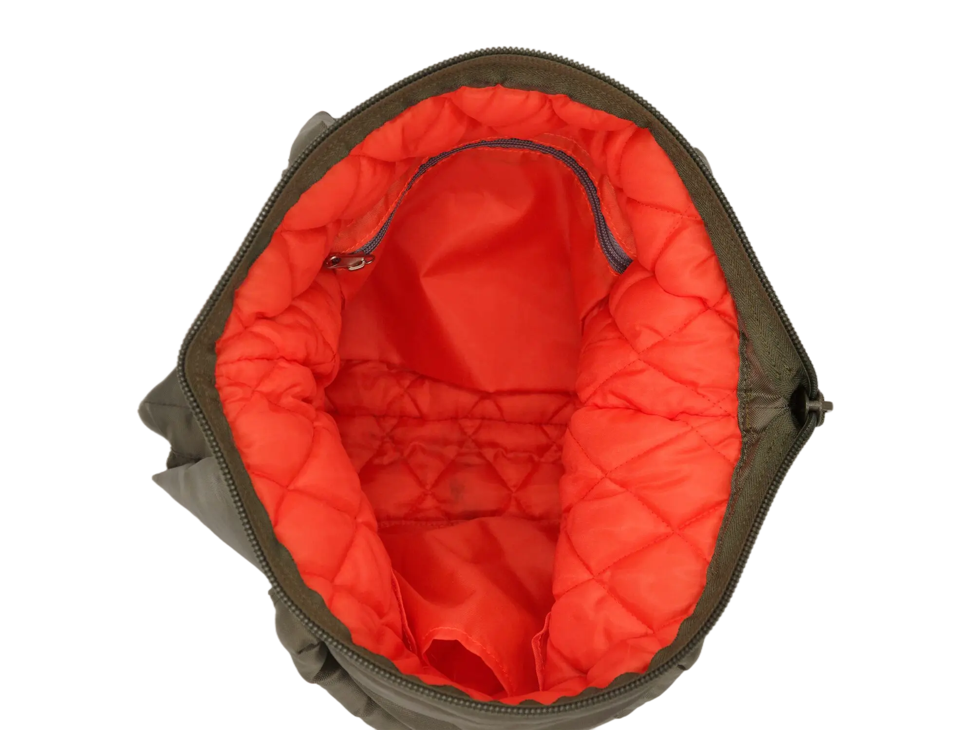 Interior overhead view of the open main compartment showing bright orange quilted lining and a small interior zipper pocket