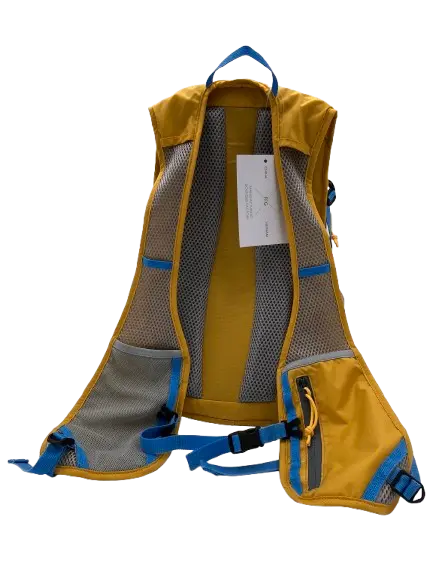 Back view of the mustard-yellow daypack with breathable mesh back panel, blue padded shoulder straps and side mesh pockets