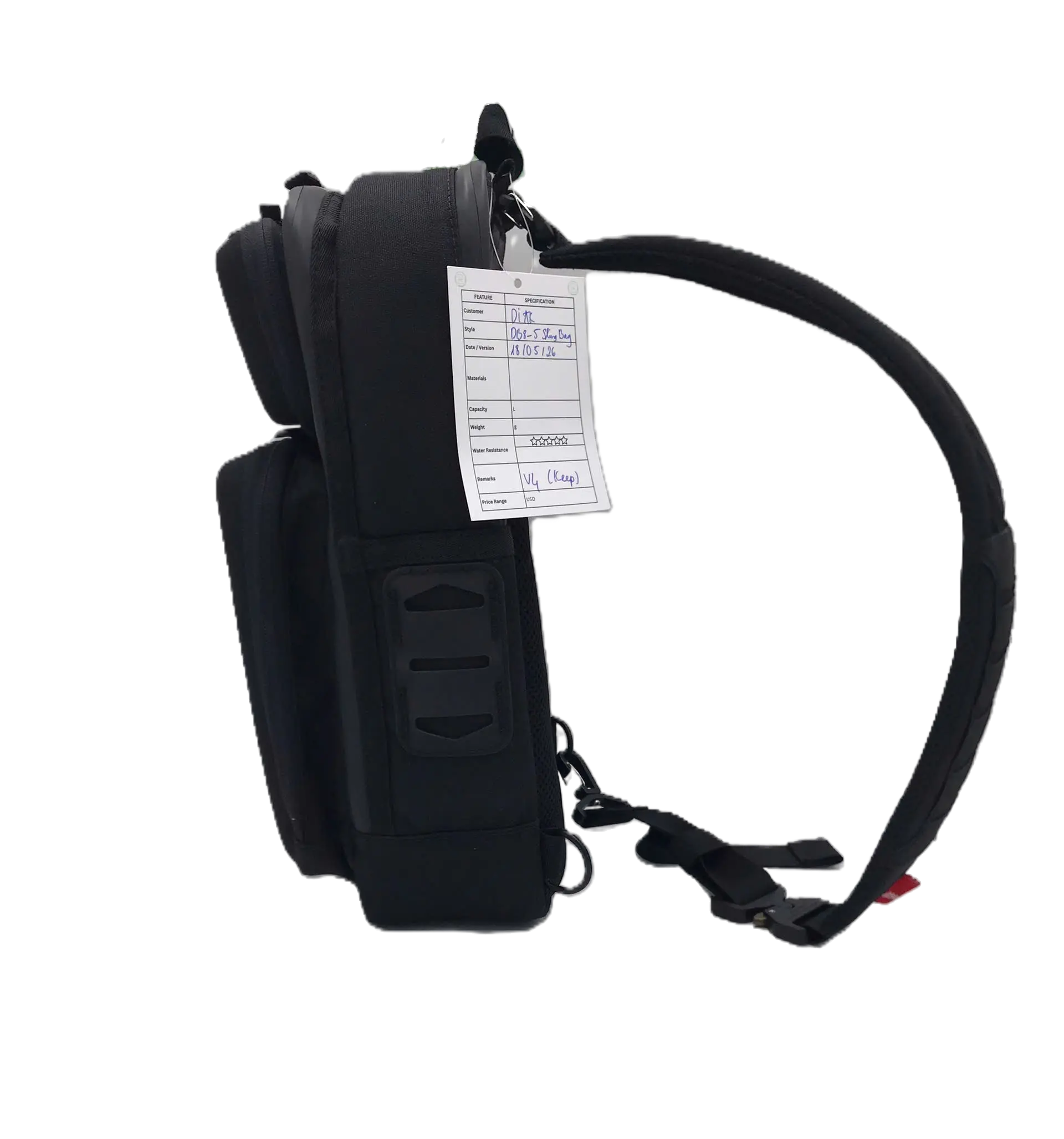 Right side profile of the black sling tool bag with a padded sling strap, side zip pocket, and a production hangtag attached