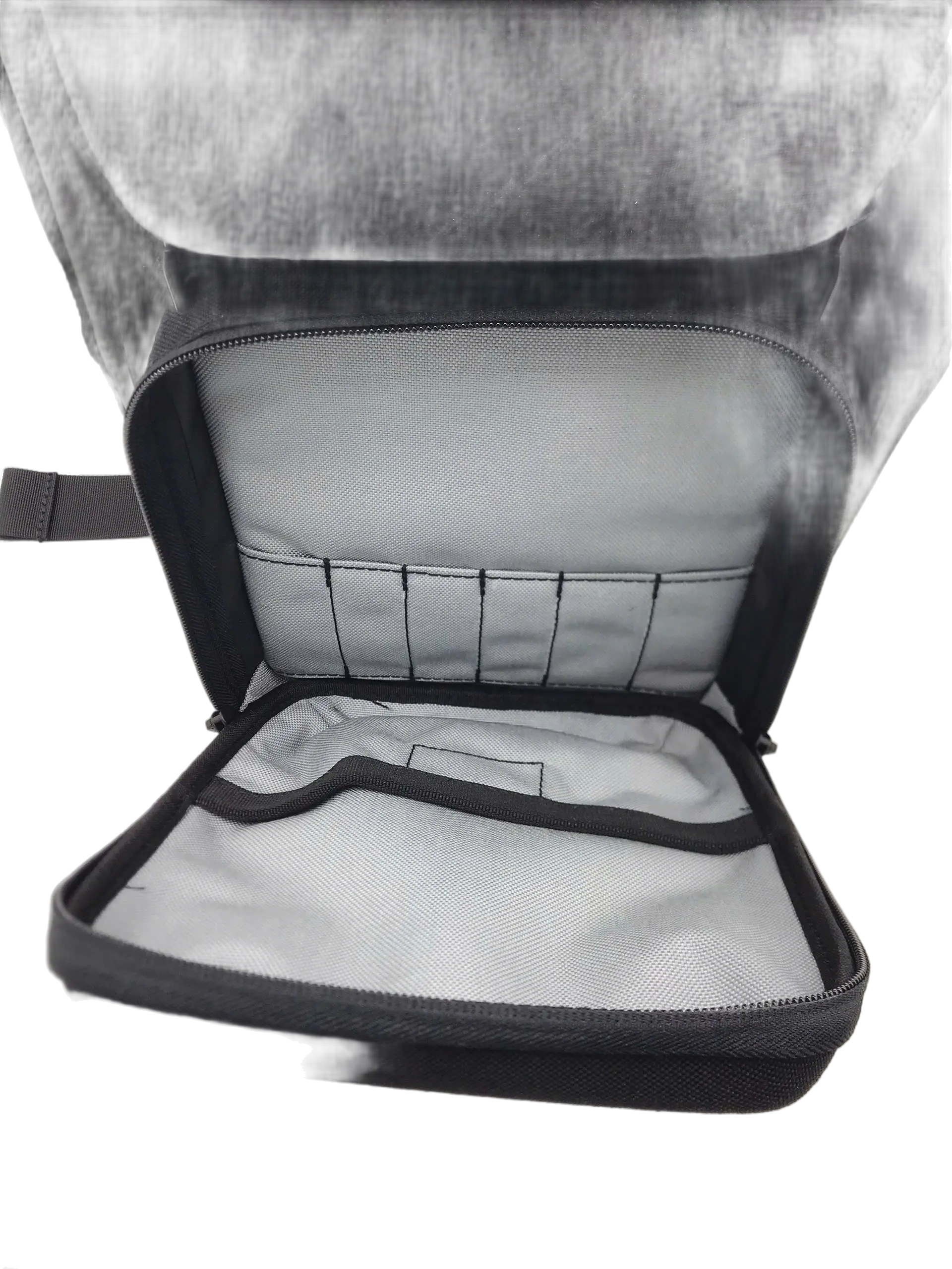 Open main compartment showing grey lining, a row of elastic tool loops along the top panel, and a flat interior divider