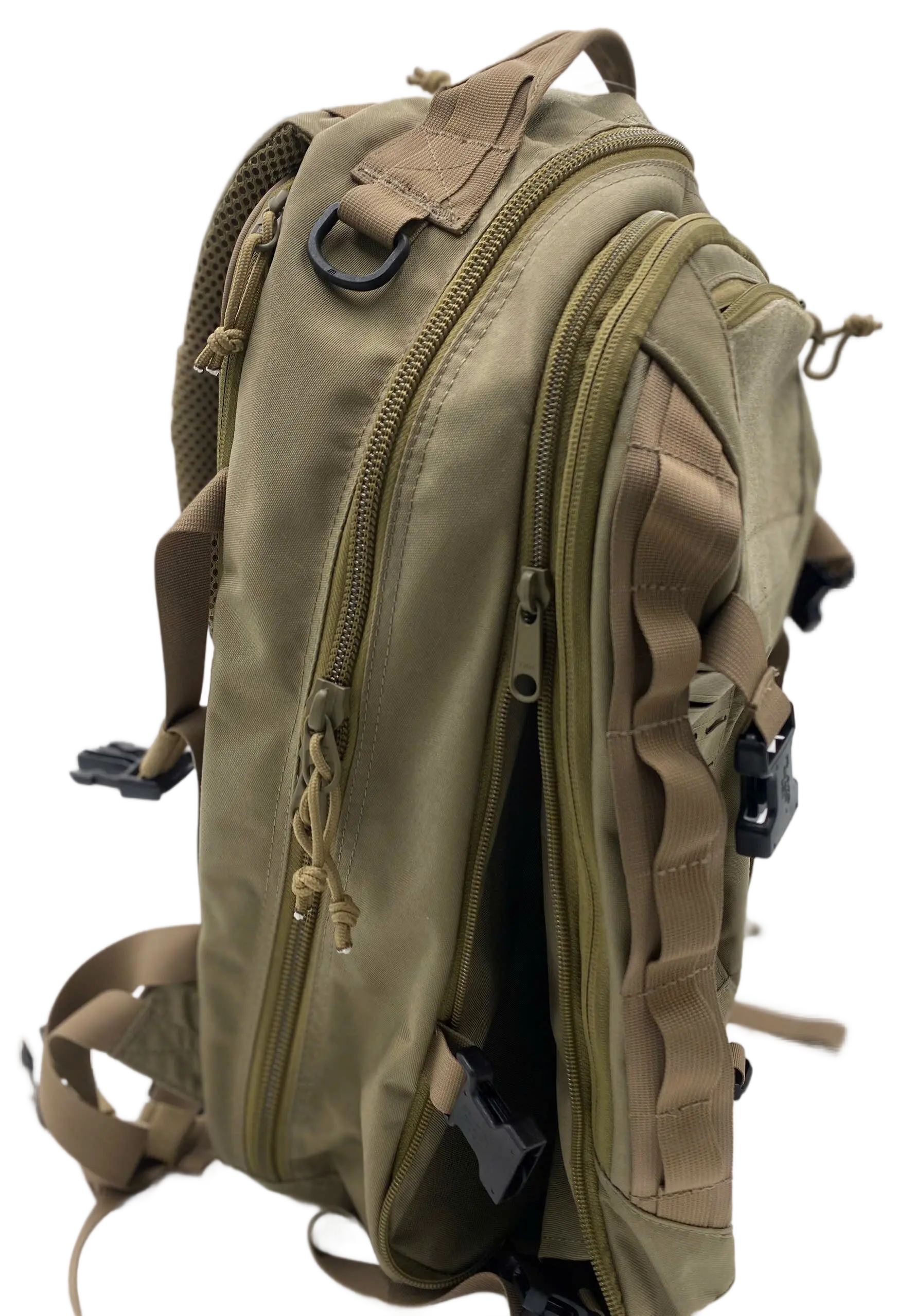 Close-up profile of the tan tactical backpack top section showing YKK zippers, shoulder strap, and D-ring hardware