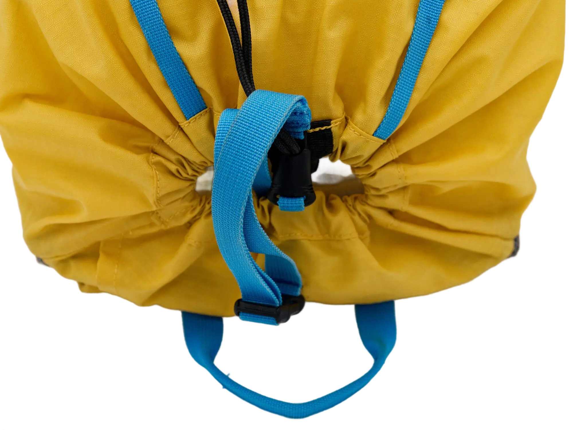 Top close-up of the pack opening showing the yellow nylon drawstring closure with blue webbing cinch and black cord toggle