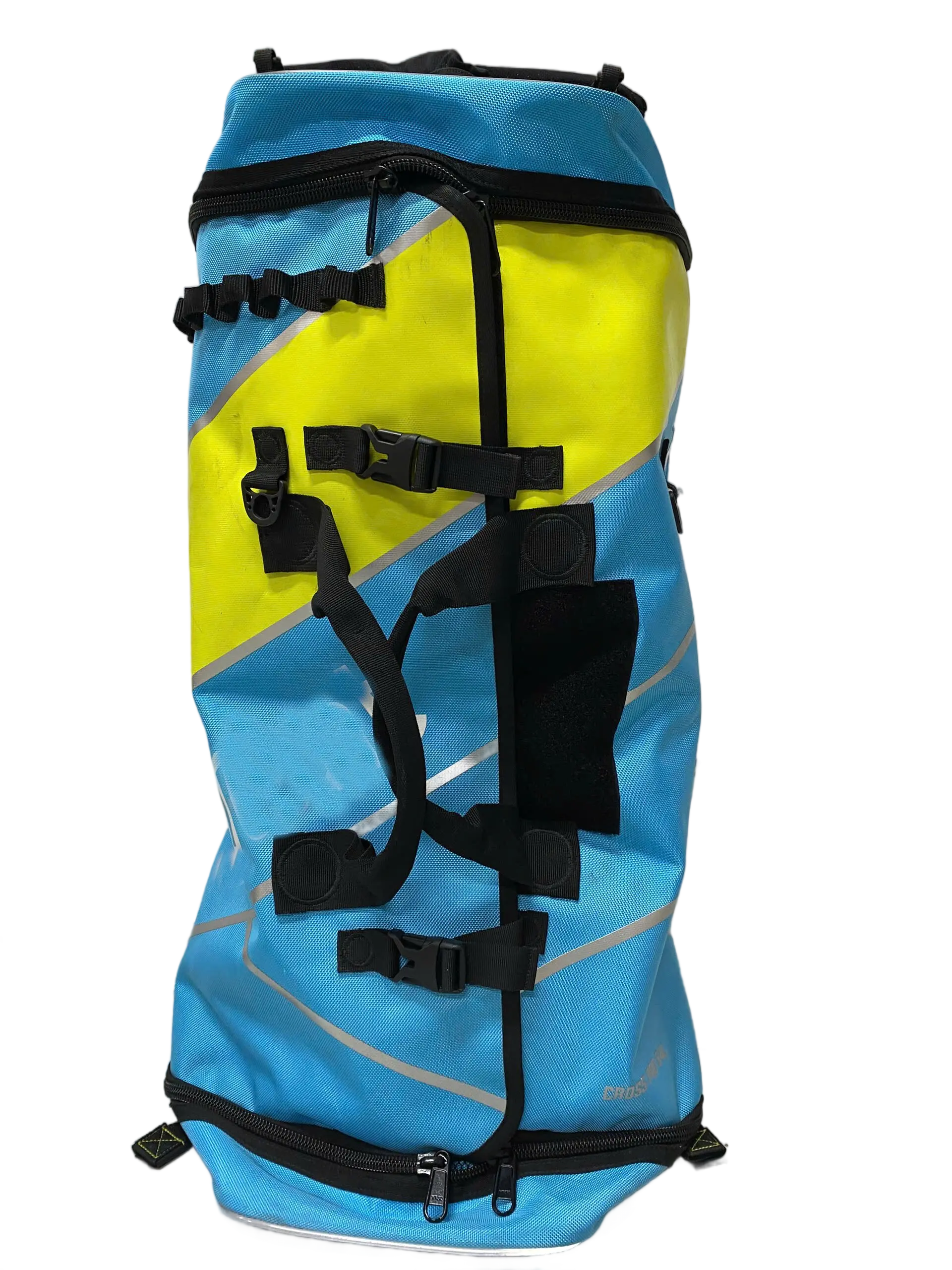 Side view of the blue and yellow backpack showing external webbing buckles for helicopter attachment