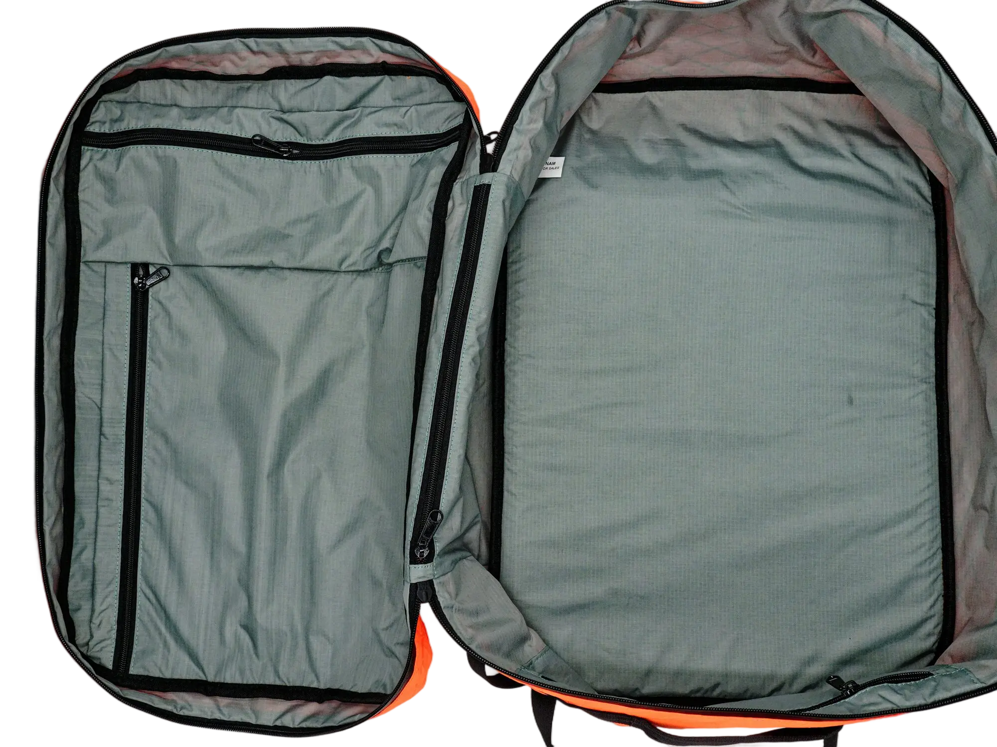 Interior open view showing two-section grey lining with interior zippered pocket on the left side