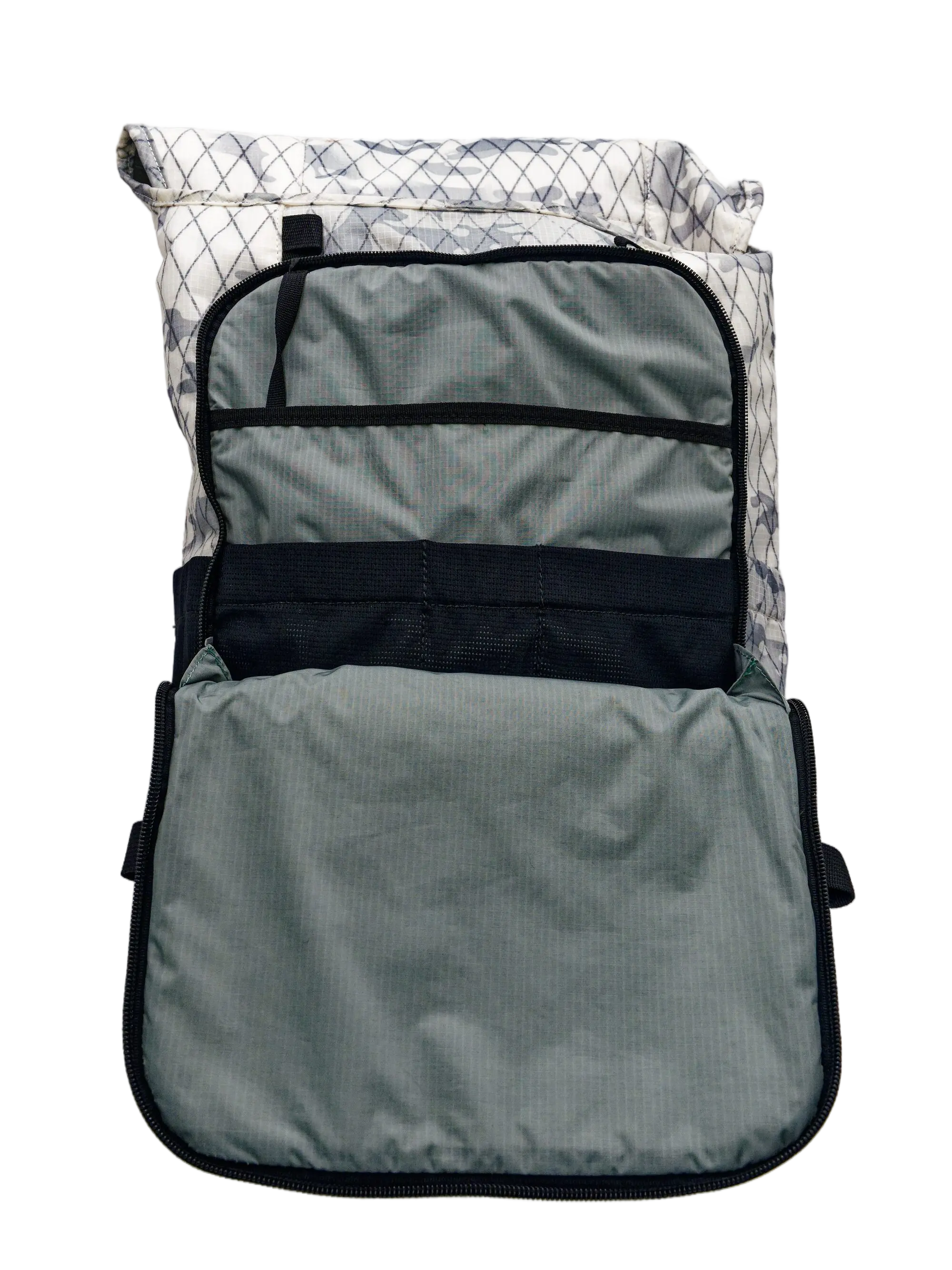 Open main compartment of the X-Pac backpack with grey lining, a mesh panel, elastic organizer straps, and a flat document sleeve