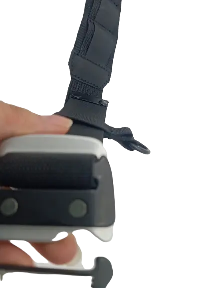 Hand-held close-up of the metal quick-release buckle and D-ring on the black padded work belt