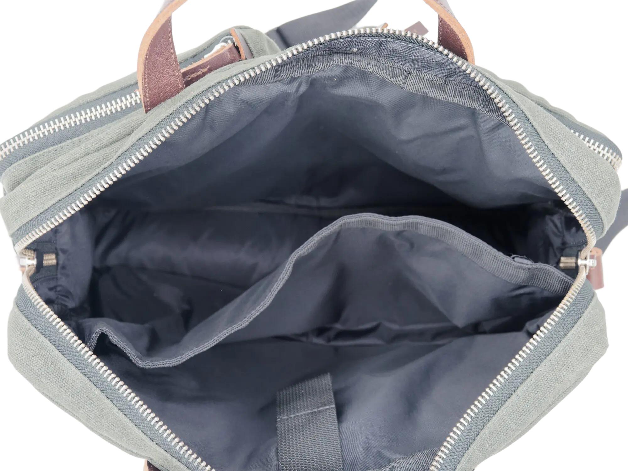 Interior view of the open messenger bag showing the navy blue lining and padded divider separating the main compartments
