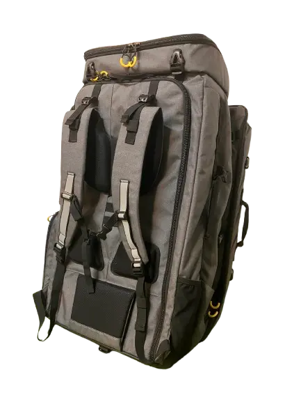 Three-quarter rear view of the closed grey carrier with padded shoulder straps, multiple buckles, and yellow D-rings