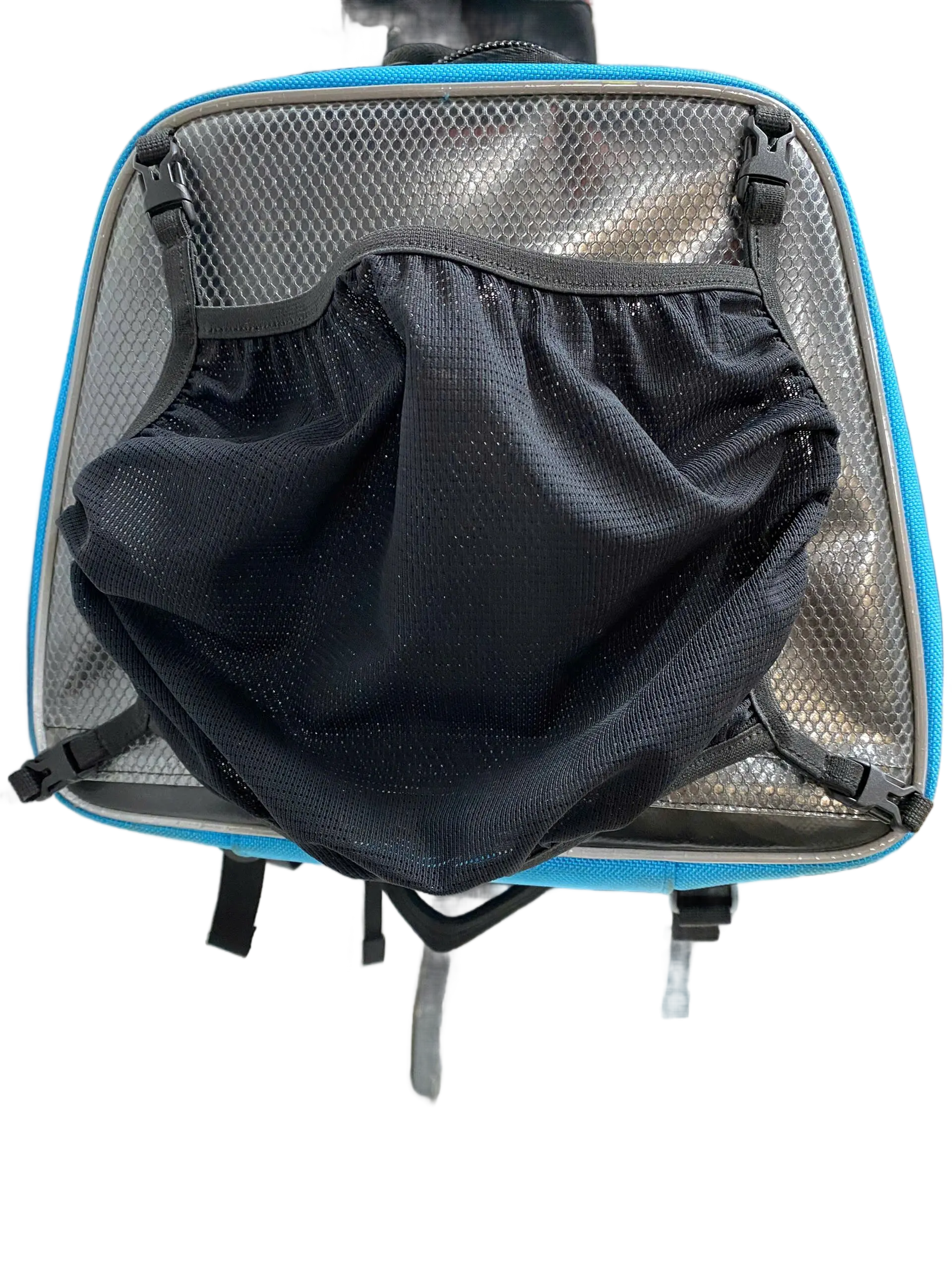 Interior view of the main compartment showing black mesh lining and folded mesh inner organizer bag