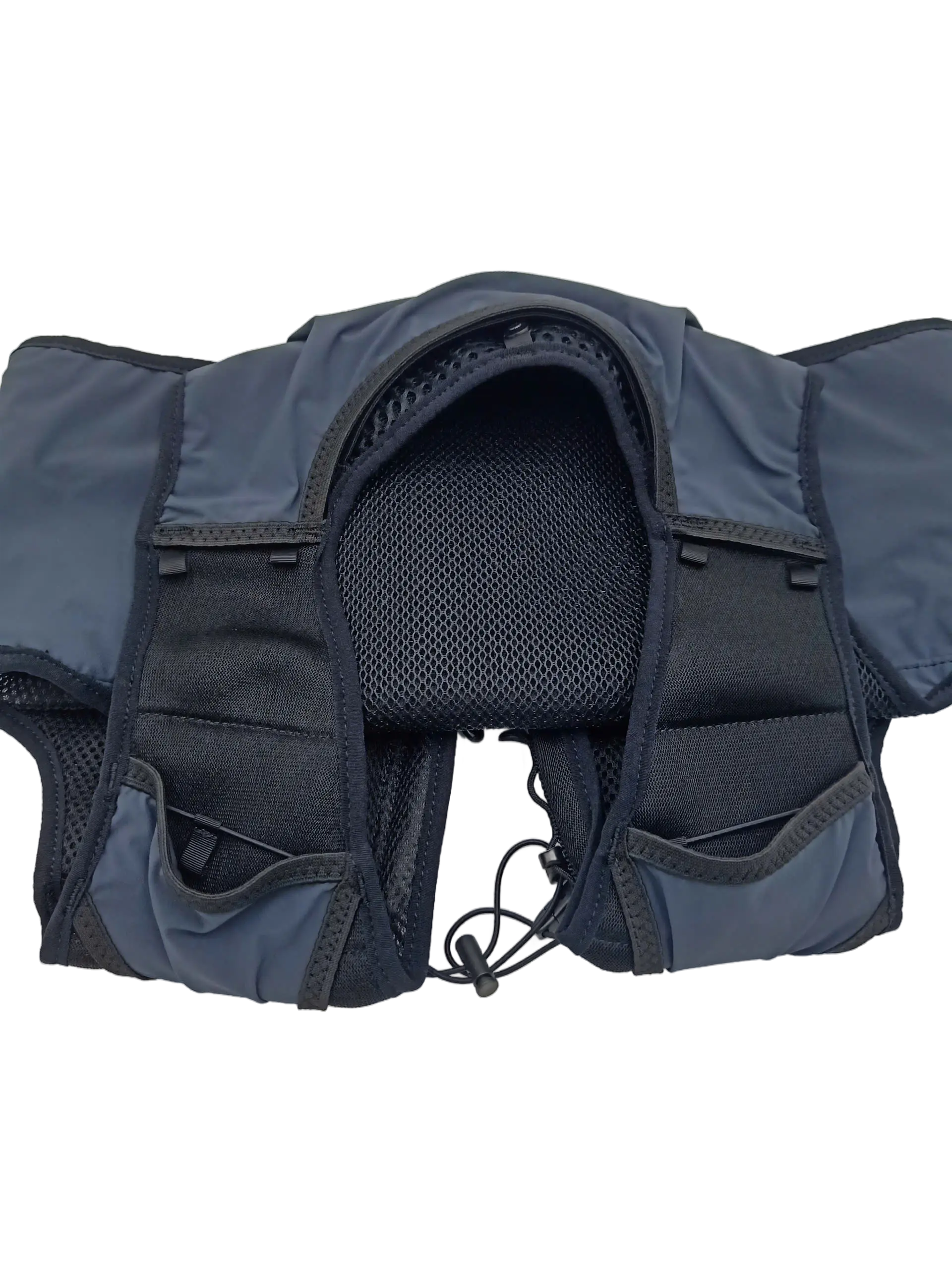 Top-down view of the vest laid flat showing the open rear compartment with central mesh padding and shoulder harness