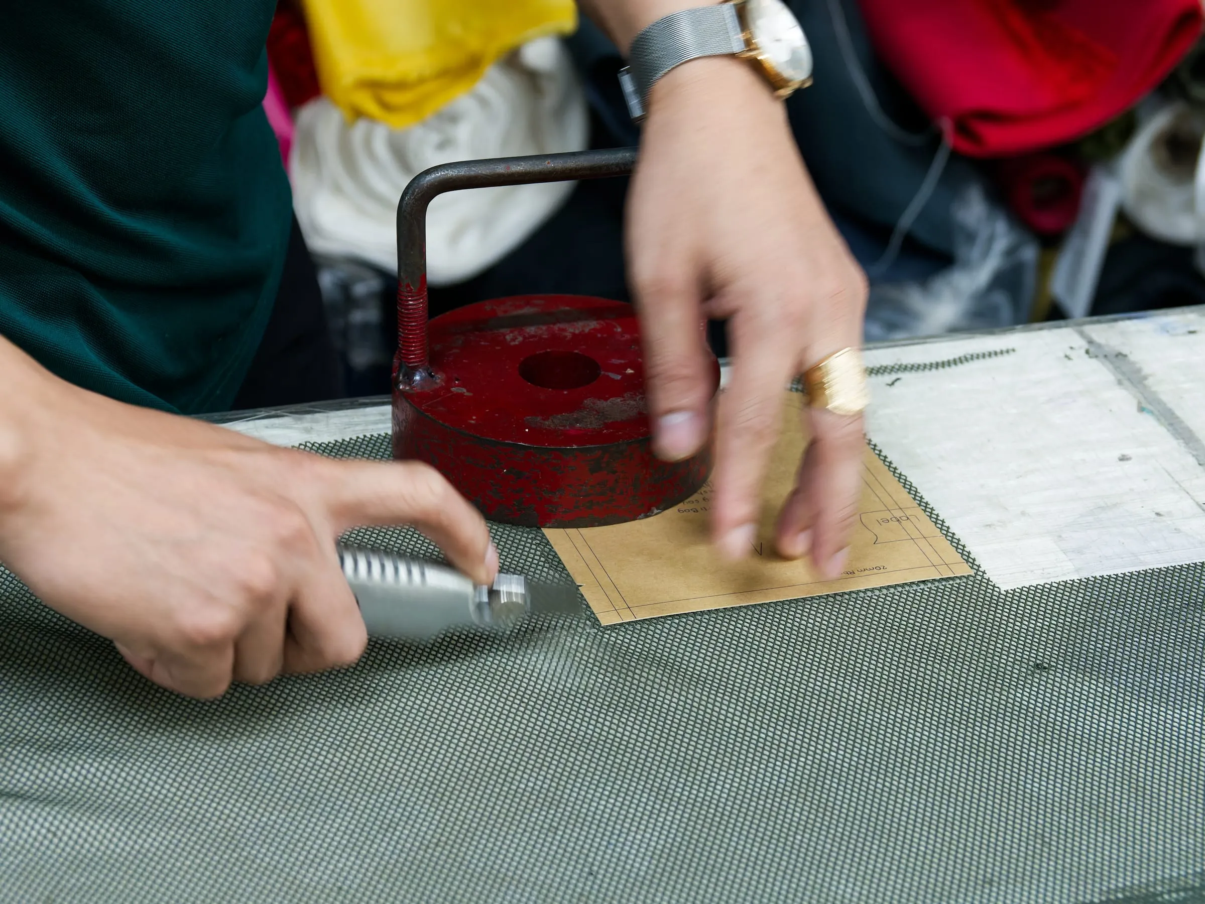 Close-up of fabric cutting and pattern work during bag sampling at FFG Bags
