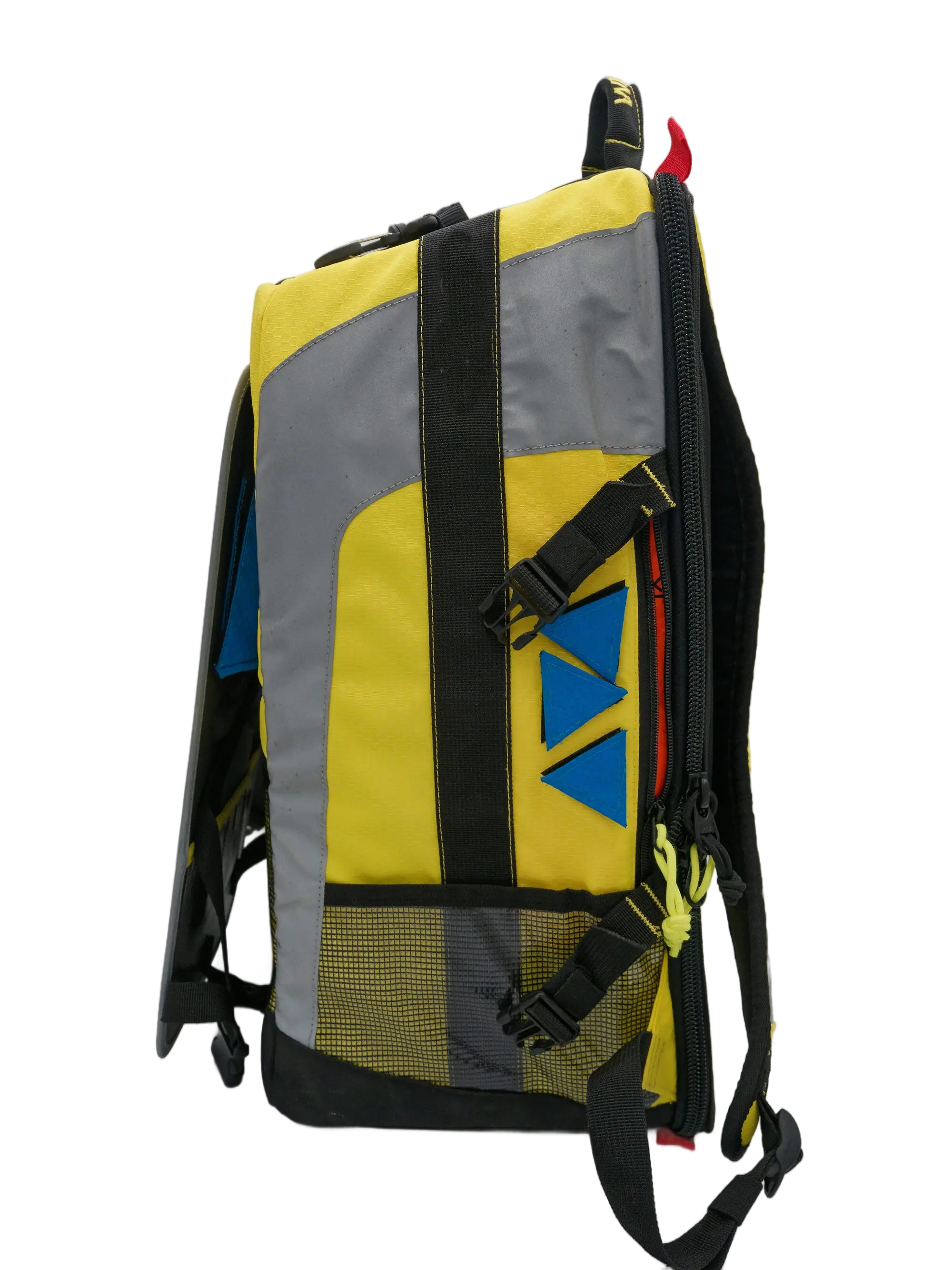 Side view of the yellow, grey and black emergency backpack with a blue triangular Velcro ID patch and buckle straps