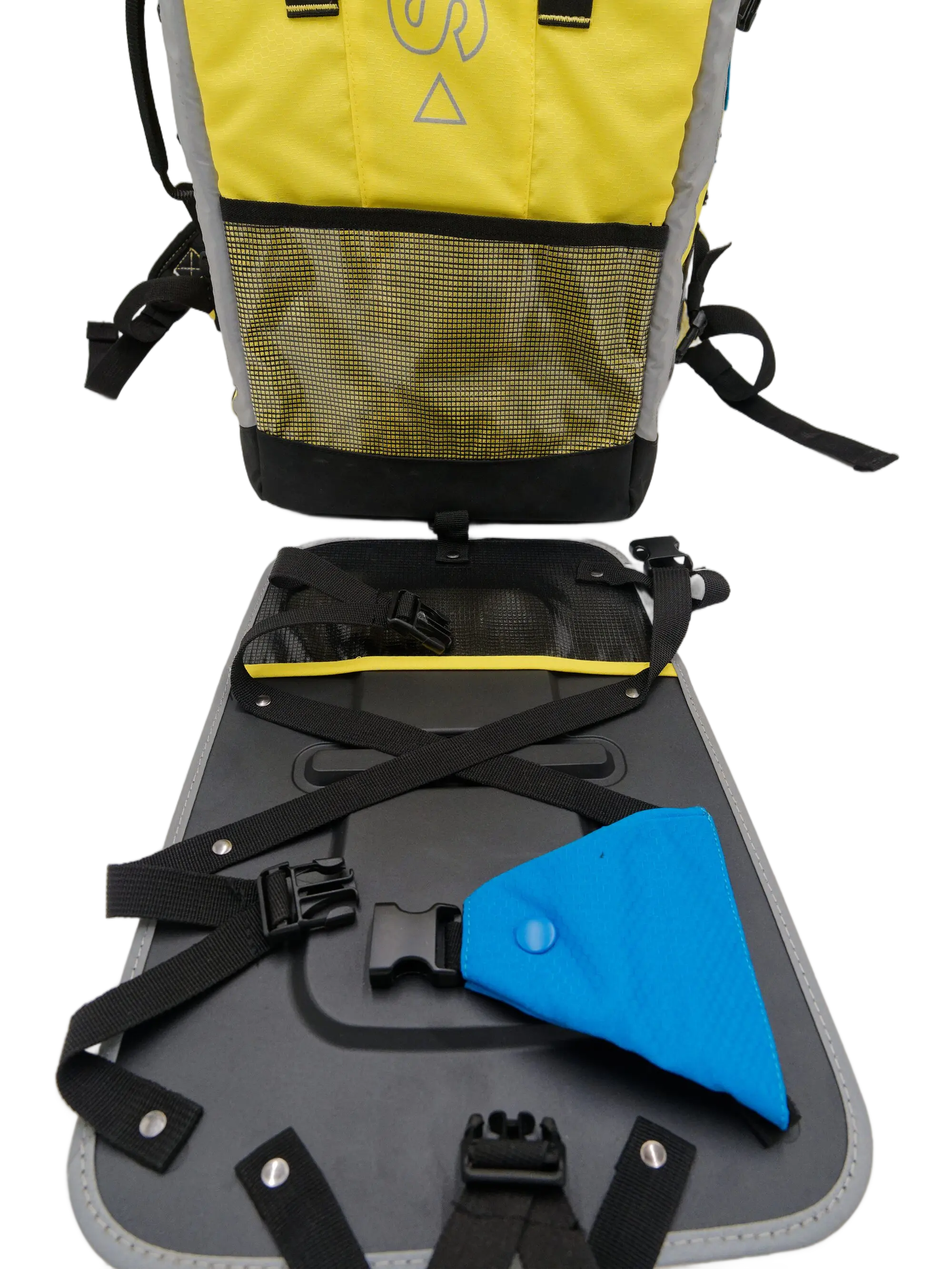 Open rear panel with ABS plate laid flat, black webbing straps, buckle hardware, and blue triangular Velcro ID attachment