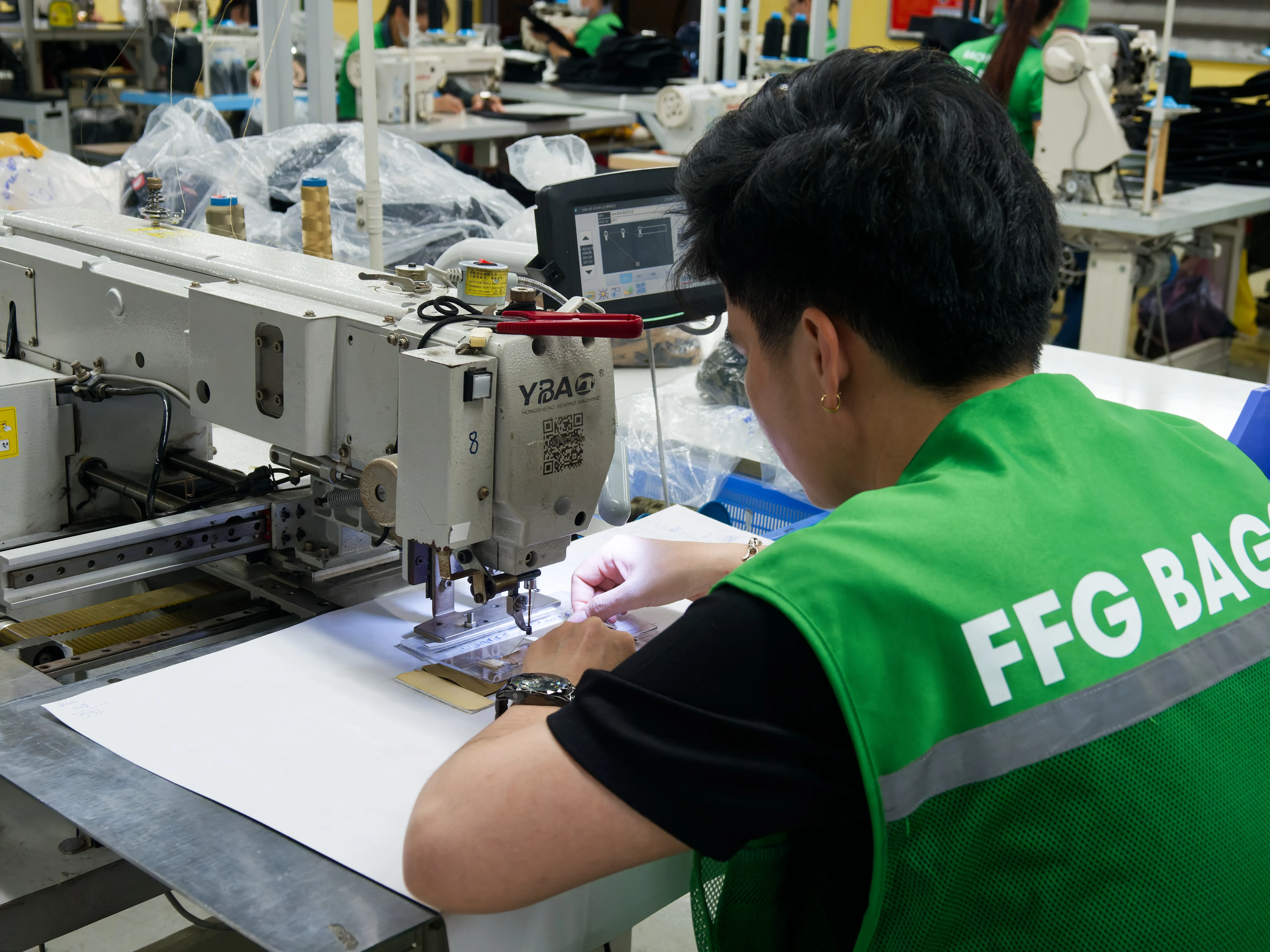 FFG Bags operator completing precision stitching work at an industrial sewing station