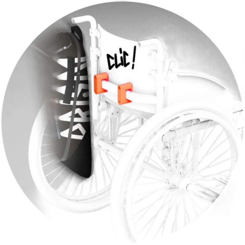 Side view of the black ripstop wheelchair bag mounted on a chair frame with orange Fidlock magnetic attachment studs